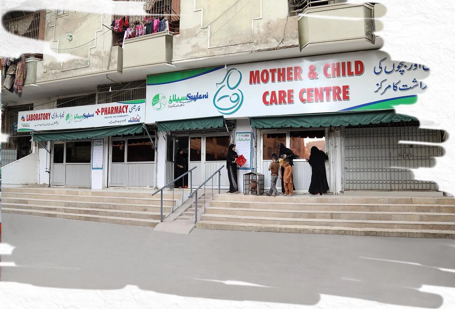 Mother and child receiving healthcare at Saylani center